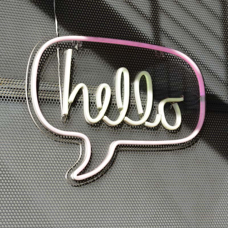 image of a neon sign that reads hello